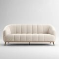 Divano 3 posti in tessuto bouclé crema con schienale scanalato, forma arrotondata e gambe in acciaio, 210 x 85 x 78 cm