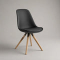 Sedia da pranzo imbottita in similpelle nera con gambe in legno, 48 x 55 x 83 cm